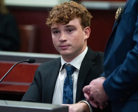 a young man is fingerprinted in court