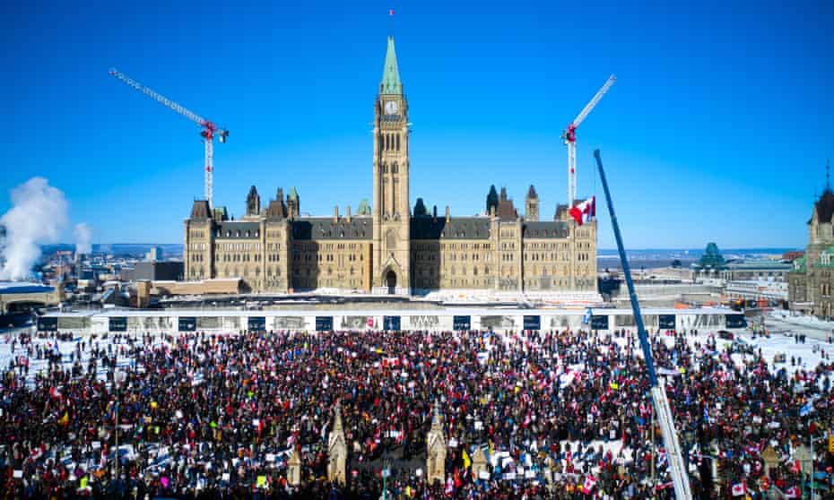 A crowd of protesters in front of Parliament Hill in Ottawa on 29 January. 
