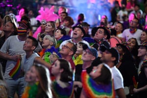 Spectators are seen in the crowd during the 43rd annual Gay and Lesbian Mardi Gras parade.