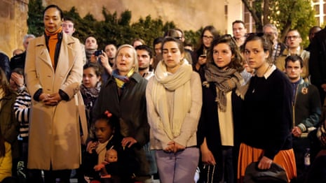 Parisians sing hymns as they watch Notre Dame burning – video