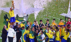 Brazil captain Cafu hoists the World Cup trophy high after their 2-0 win over Germany in June 2002.