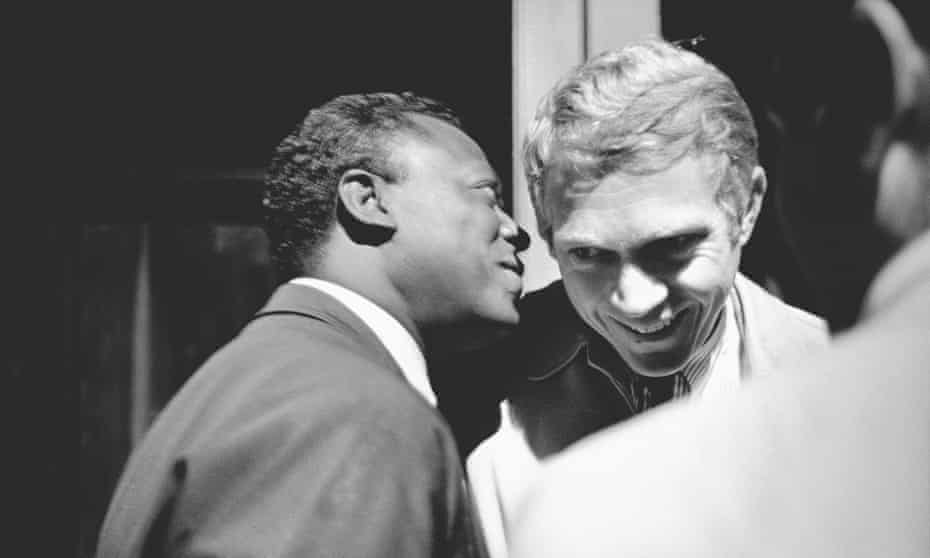 Miles Davis in conversation with actor Steve McQueen, backstage at the 1963 Monterey jazz festival.