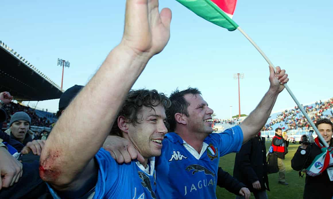 Diego Domínguez (left) celebrates with his half-back partner, Alessandro Troncon, after Italy vanquished Wales in the opening match of the 2003 Six Nations at the old Stadio Flaminio
