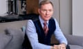 Chris Bryant sitting on a couch with hands clasped and arm resting on his knees