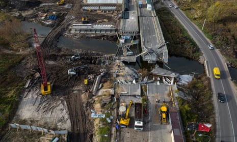 Construction is seen on the Irpin bridge that was destroyed to block the Russian advance toward the city.