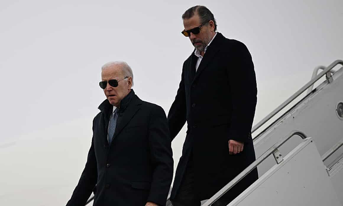 Joe Biden and Hunter Biden walk down aircraft steps