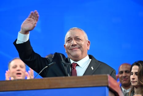 Eisenkot waving to supporters from a podium at the Yashar party's campaign headquarters in Tel Aviv last night