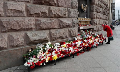 A woman stands at a memorial in Moscow to the victims of the Islamic State terrorist attack at the Crocus City Hall.