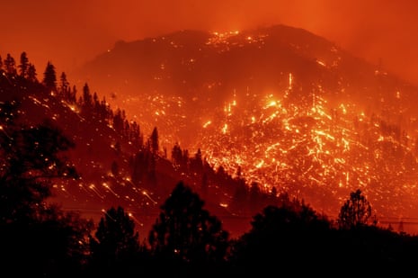 Embers light up hillsides as the Dixie fire burns in Lassen county, California.