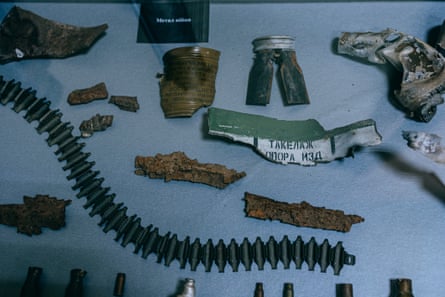 Pieces of munitions, including shell casings, shrapnel with Cyrillic writing and machine-gun belts
