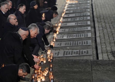 Heads of state and survivors attend the candle-lighting ceremony.