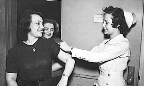 US Office of War Information employees receive free inoculations against smallpox in 1943