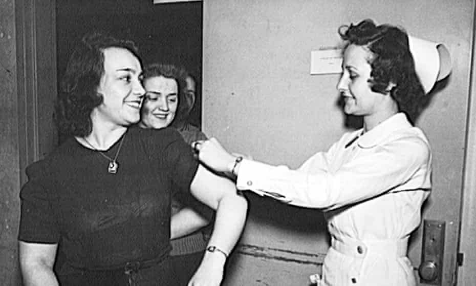 US Office of War Information employees receive free inoculations against smallpox in 1943