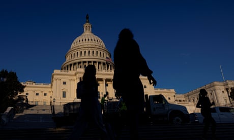 Silhouettes in front of Capitol building in Washington