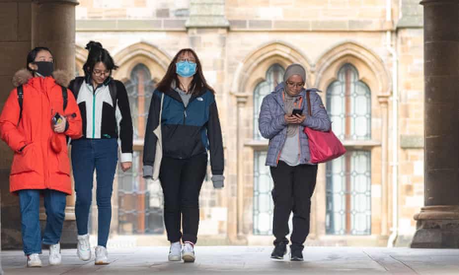 Students at Glasgow university wearing face masks as the university moves all student exams online due to the virus outbreak.