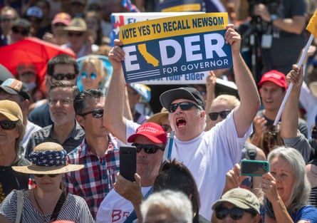 David Mead of Thousand Oaks, California, shows his support for Larry Elder at a rally on 6 September.