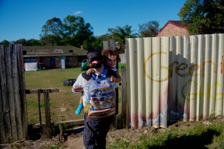 Deslie with Ezzard outside her family home