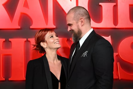 Lily Allen and David Harbour smile at each other on the red carpet for a premiere