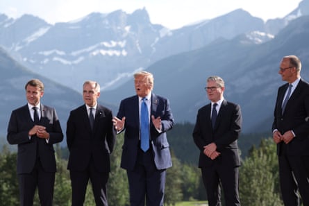 Donald Trump, with Emmanuel Macron, Mark Carney, Keir Starmer and Friedrich Merz prepare for a family photo session during at the G7 summit in Alberta, Canada