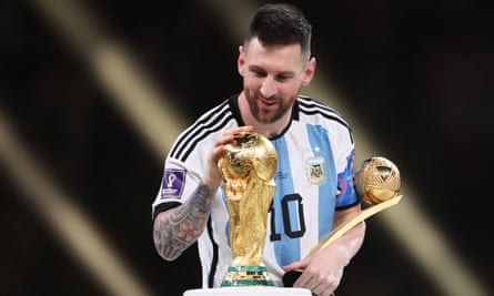 Messi strokes the World Cup trophy tenderly