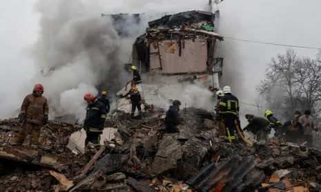 Rescuers work at the site of an apartment building hit by a Russian missile strike, amid Russia's attack on Ukraine, in Poltava, Ukraine over the weekend.