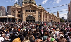 People at the intersection of Flinders Street station during the Invasion Day rally in Melbourne/Naarm on 26 January 2024
