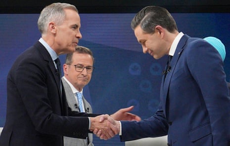 Liberal leader and prime minister Mark Carney, left, shakes hands with Conservative rival Pierre Poilievre following the French-language federal leaders' debate, in Montreal, with Yves-François Blanche of the separatist Bloc Québécois in the background.