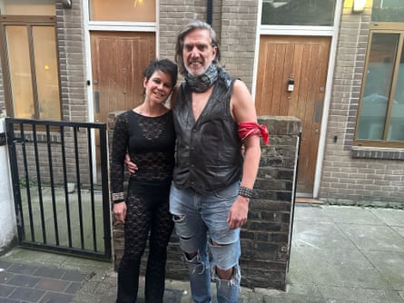 a couple wear rock and roll clothing to a gig.
