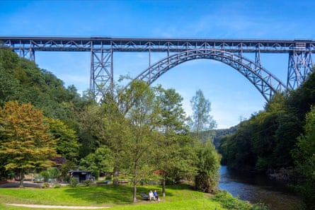 Iron bridge over a river and wooded valley