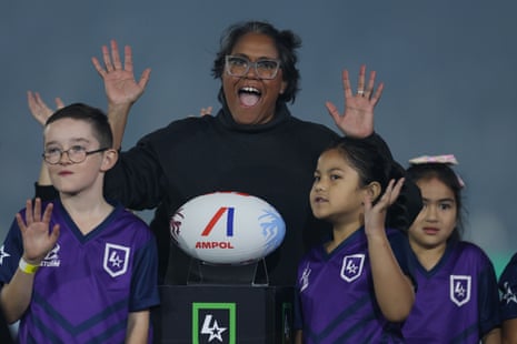 Cathy Freeman delivers the official match ball at the MCG.