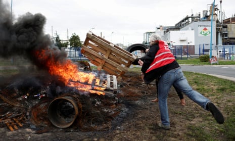 Workers on strike burn a fire in front of the ExxonMobil oil refinery in Port-Jerome-sur-Seine