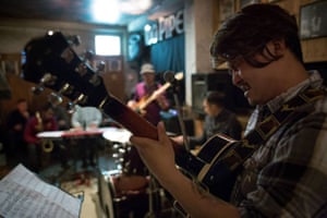 Man playing guitar at Jazz Upstairs, Kathmandu, Nepal.