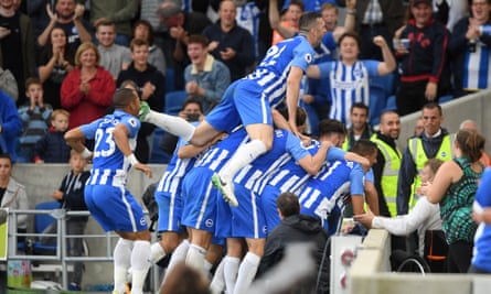 Brighton players celebrate after Tomer Hemed scores the hosts’ third goal.