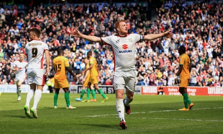 Dean Lewington celebrates a goal against Yeovil in 2015