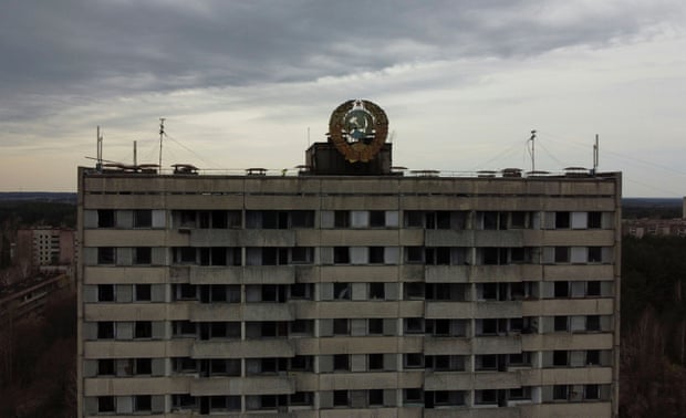The coat of arms of the Soviet Union is seen on the roof of a building in the abandoned city of Pripyat
