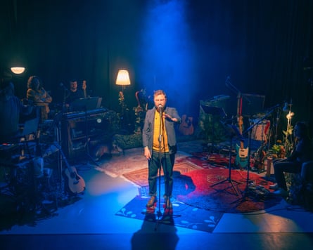 Man in spotlight on stage