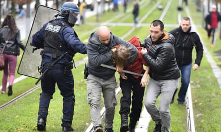 Police arrest a high school student during a demonstration in Bordeaux.