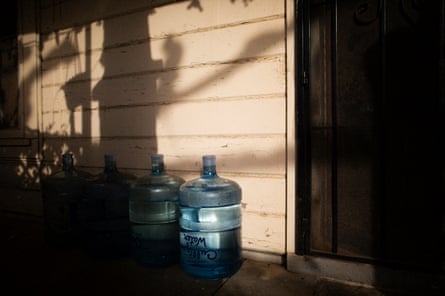 Bottled water on a front porch in Tombstone Territory, an unincorporated working class neighborhood south-east of Fresno, California, 21 February 2020.