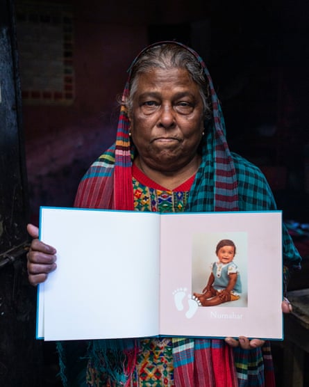 Rezia Begum holds a picture of her daughter.
