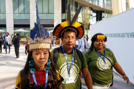 Participants in traditional outfits at COP28