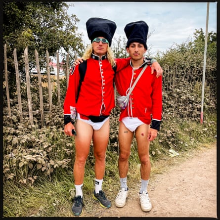 Adam Caldwell, left and Ollie Bowen are walking around the music festival as Trouserless Coldstream Guards. They only met yesterday, a day before the festival