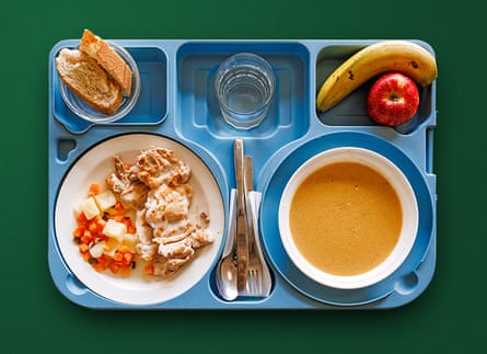 Lunch separated into compartments on a blue tray