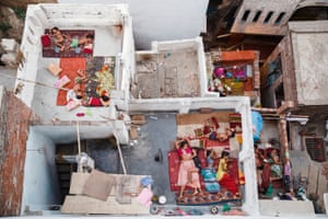 Families sleep on the roof of their homes as temperatures soar in Varanasi, India.