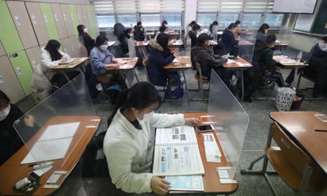 South Korean students take their College Scholastic Ability Test at a school in Seoul, South Korea.