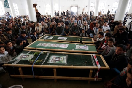 Yemenis gather around the coffins of Houthi fighters killed in recent clashes with Saudi-backed government forces, in Sana’a.