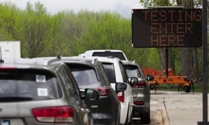 People line up for a drive-through testing clinic in Sioux City, Iowa.