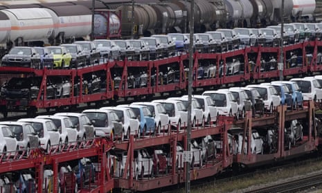 Brand new cars of German car manufacturer Volkswagen and BMW are parked on a freight train in Munich, Germany, Thursday, Oct. 14, 2021. Official statistics show that German factory orders dropped steeply in October, pushed down by much lower demand from countries outside the euro area. (AP Photo/Matthias Schrader, file)