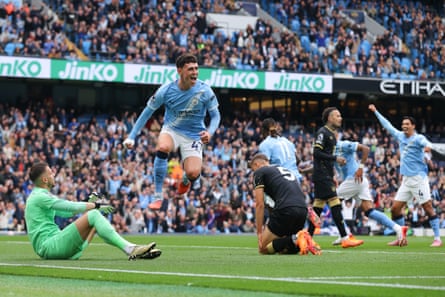 Phil Foden of Manchester City celebrates the first own goal from Maxime Estève