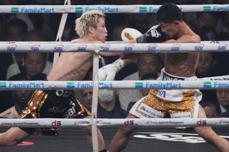 Naoya Inoue (left) lands a right on Junto Nakatani during the seventh round.