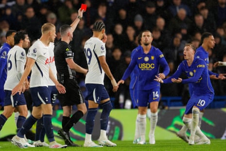 Cole Palmer pleads with the referee as he shows him the red card